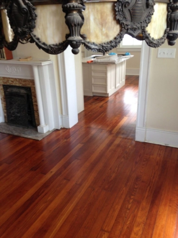Refinished hardwood flooring in living room and kitchen
