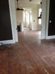 Hardwood floors in living areas prior to being refinished.