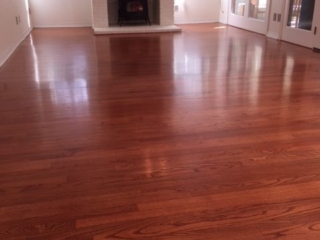 Photo of refinished new flooring after tile removal. Custom matched to existing flooring.