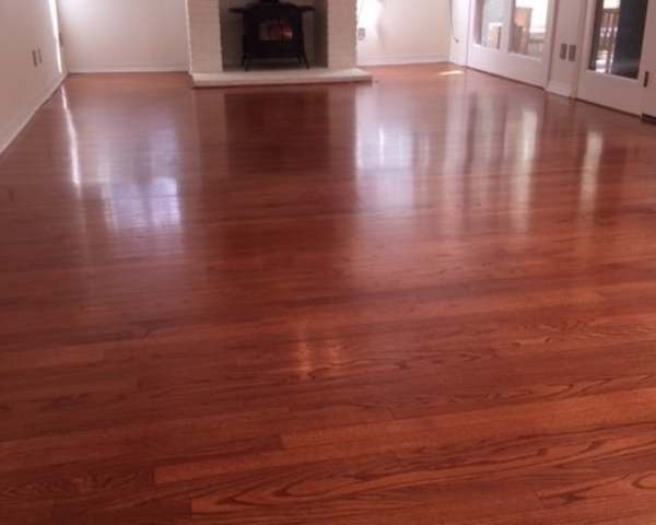 Photo of refinished new flooring after tile removal. Custom matched to existing flooring.