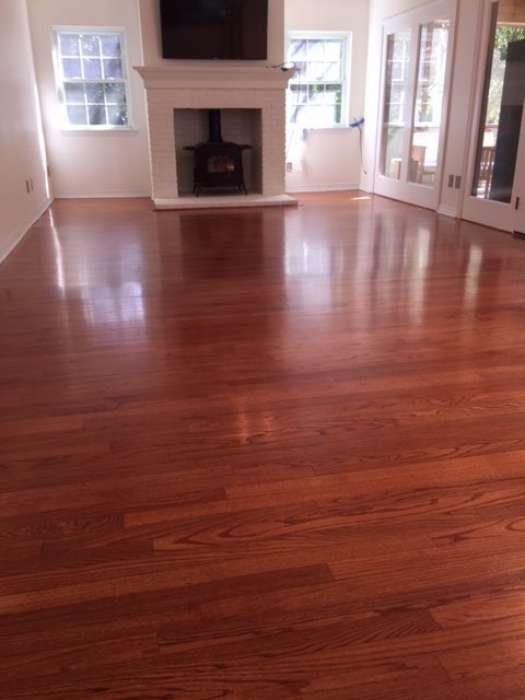 Photo of refinished new flooring after tile removal. Custom matched to existing flooring.