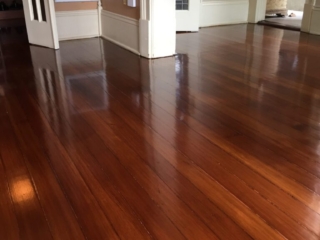 This is a hallway of refinished hardwood pine floors.