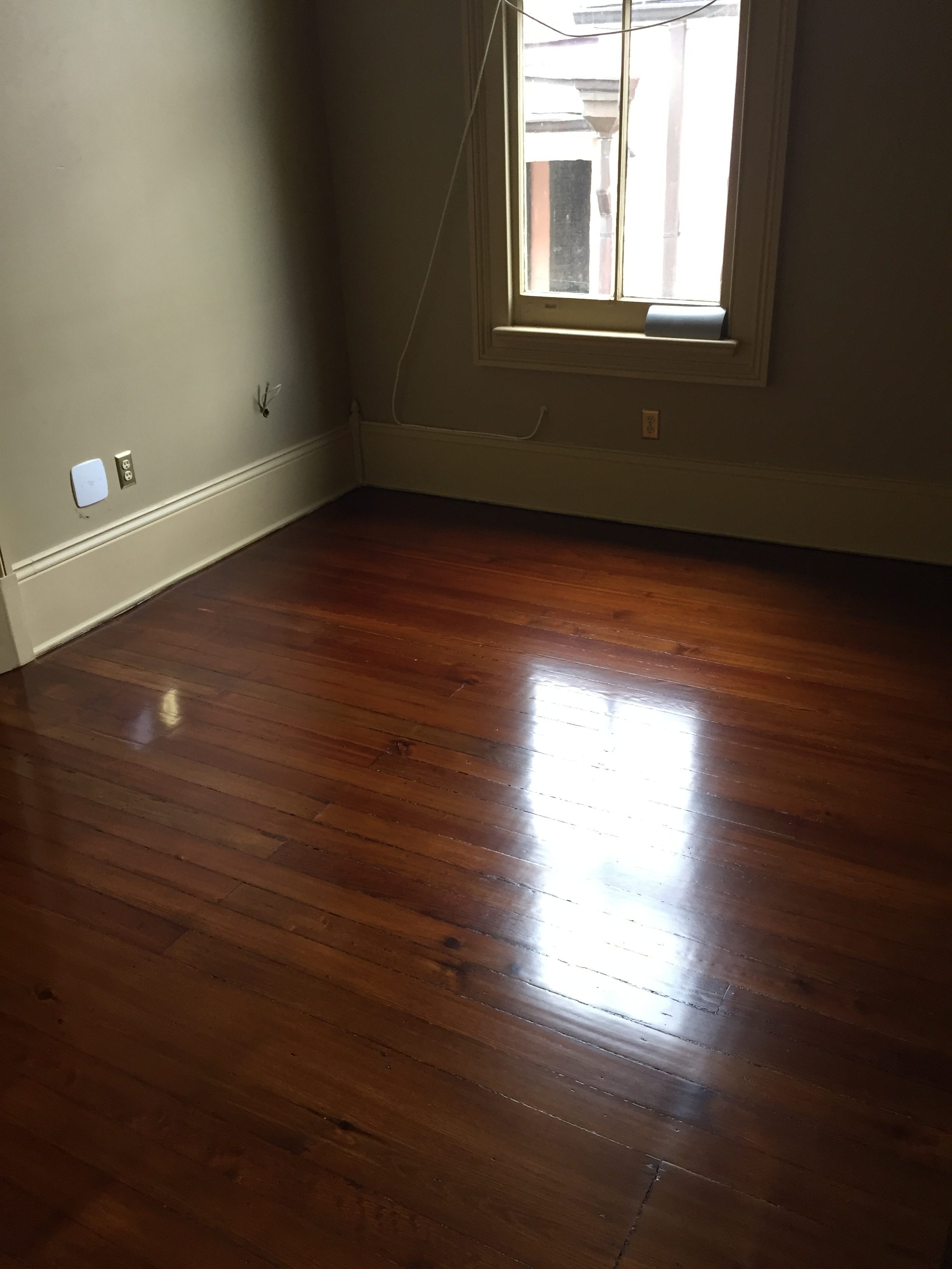 This is a bedroom of refinished hardwood pine floors.