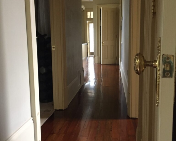 This is a hallway of refinished hardwood pine floors.