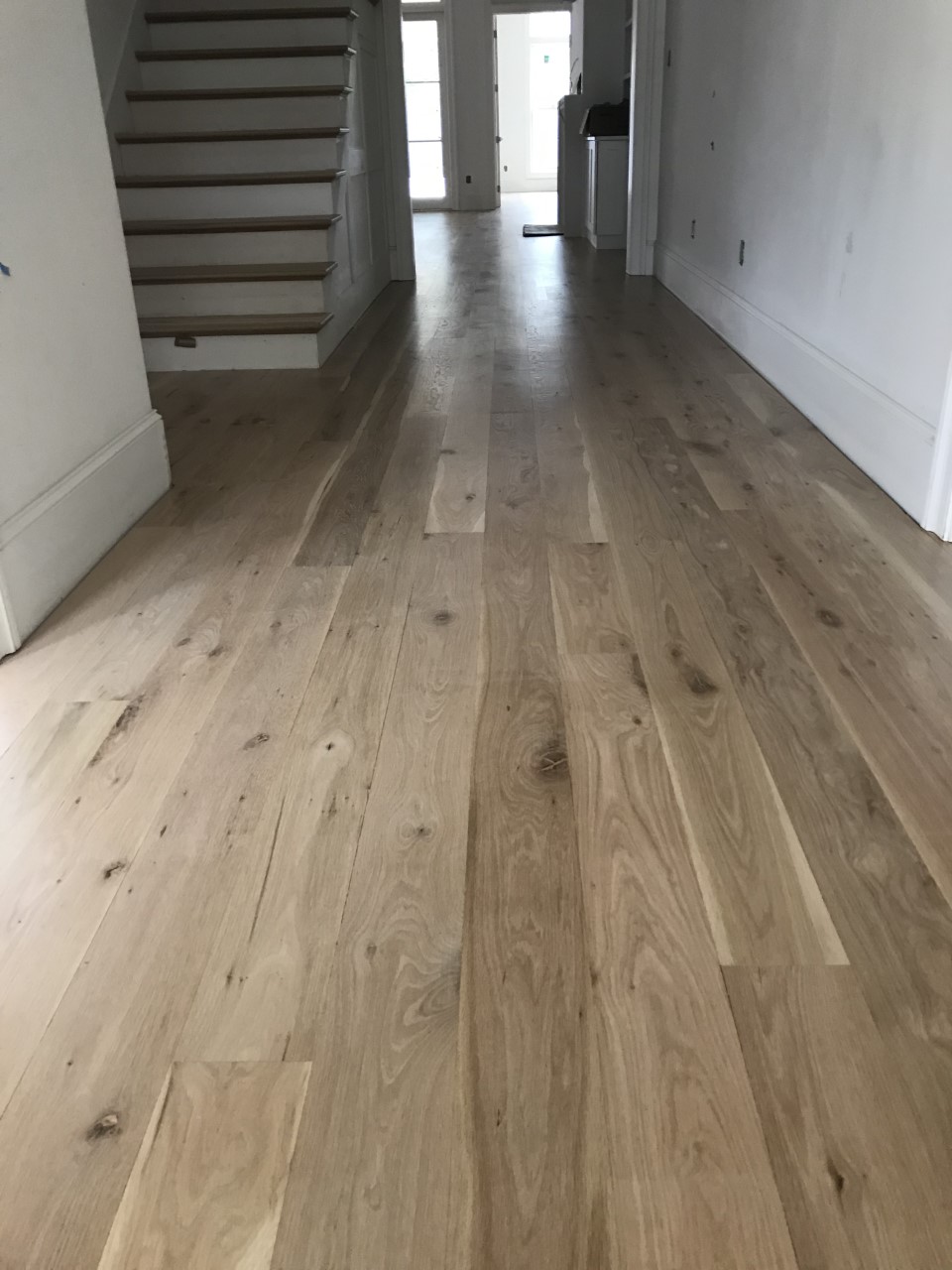 This is a photo of white oak flooring with a satin finish. It has a weather washed appearance.